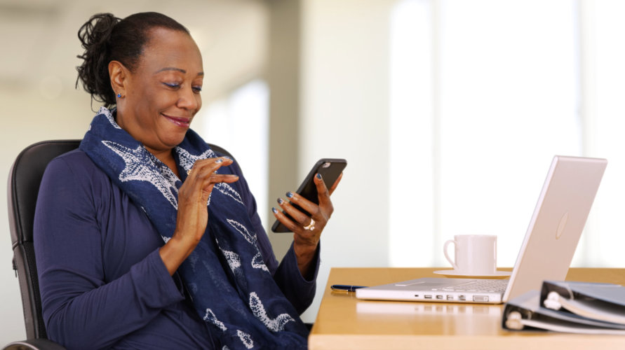 businesswoman uses her mobile phone